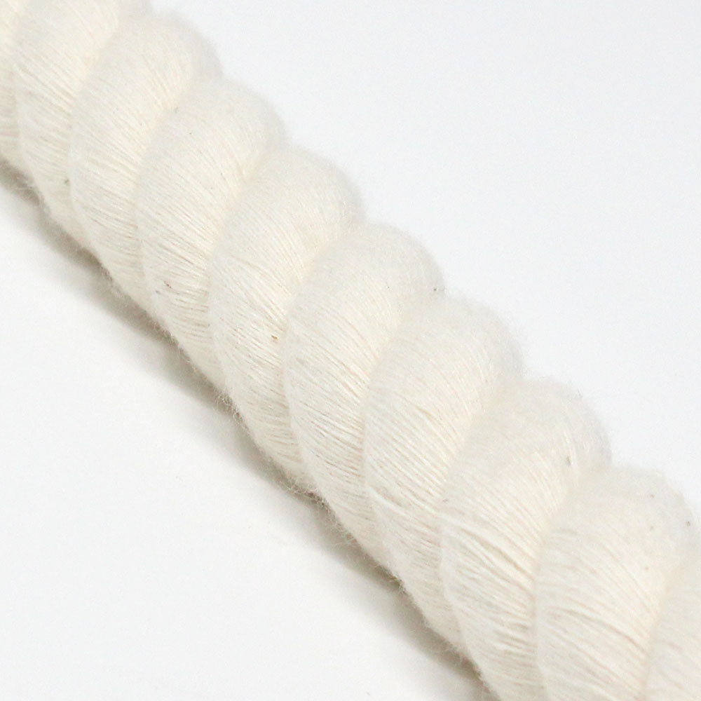 Close-up of a twisted cotton rope, showing its texture and creamy white color.