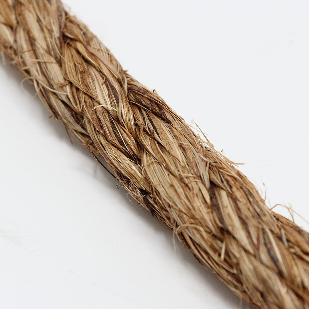 Close-up of a traditional Manila climbing rope with a 1.5 inch diameter, showing the texture and weave.