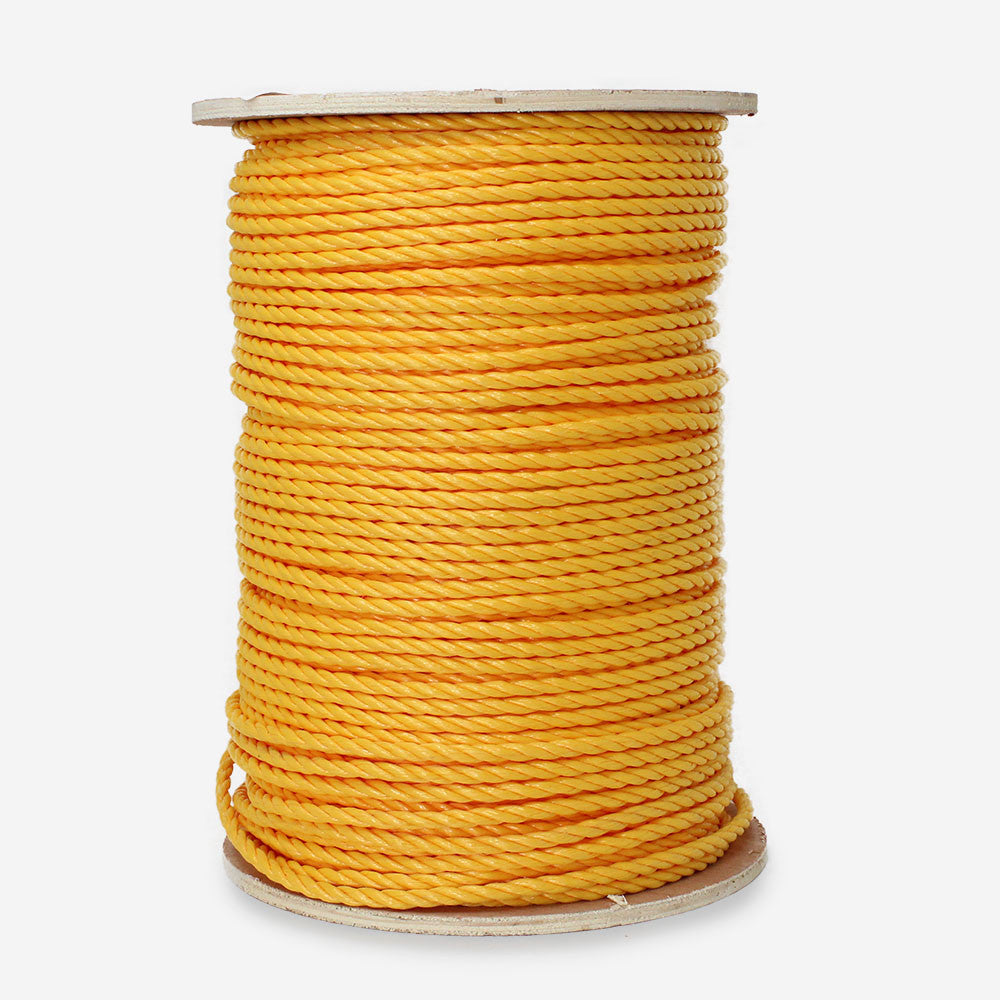 A spool of yellow twisted polypropylene rope.