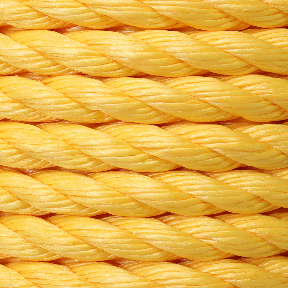 Close-up view of a twisted yellow polypropylene rope.