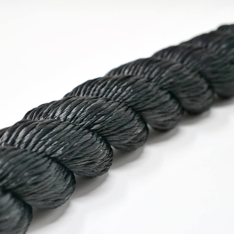 Close-up of a black polydac workout rope with a smooth texture, showing the detailed braiding and twisted design.