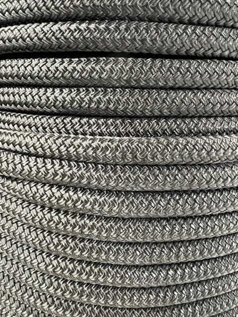 A close-up image of a black double braid nylon rope showing its texture and weave.