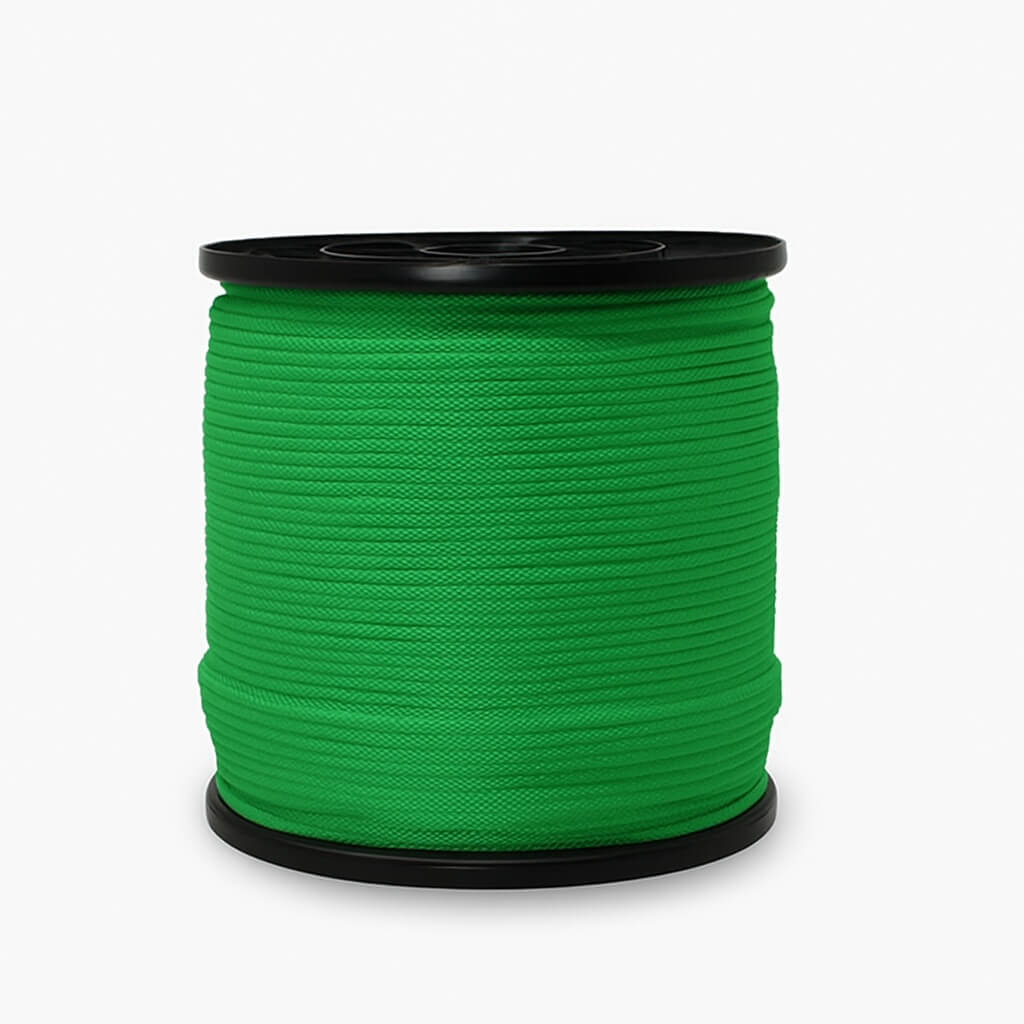 Spool of green rope on a white background