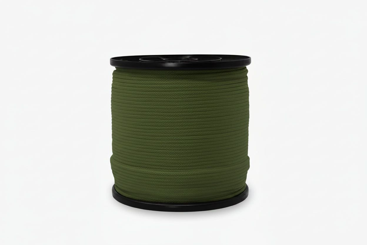Spool of green rope on a white background