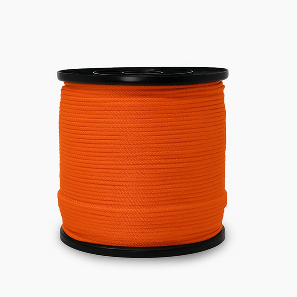 Spool of orange rope on a white background
