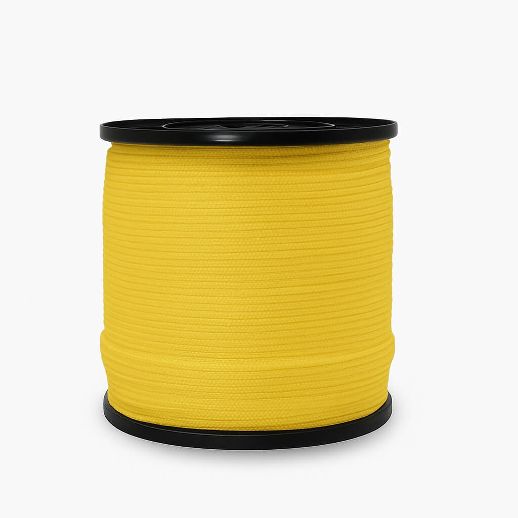 Spool of yellow thread on a white background