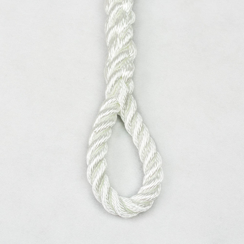 White rope with a knot on a light gray background